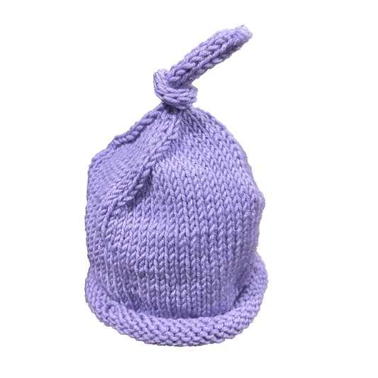 Rolled brim top knot beanie